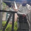 Sahibzada Faisal Badshah Zahidi Standing at the main entrance of the Mazar Paak 1